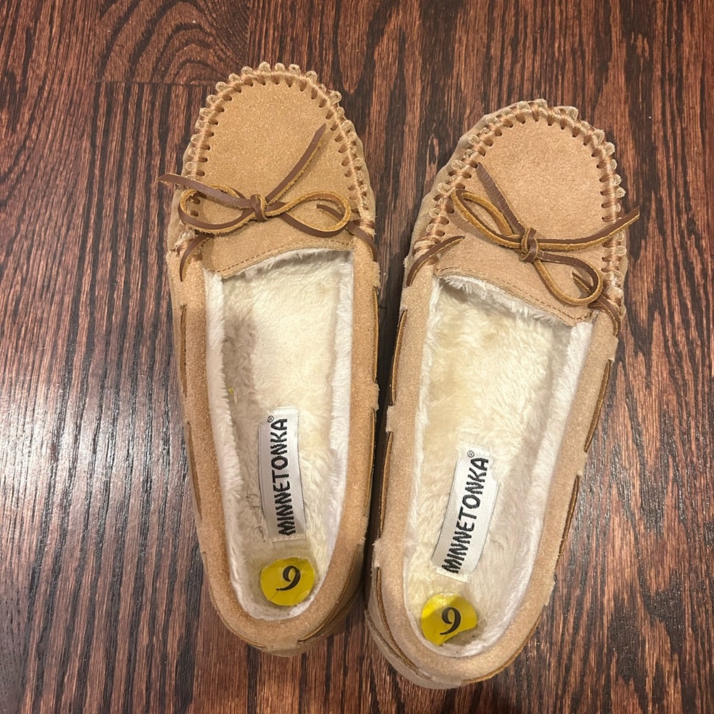 Tan moccasin Minnetonka slippers, worn a few times.